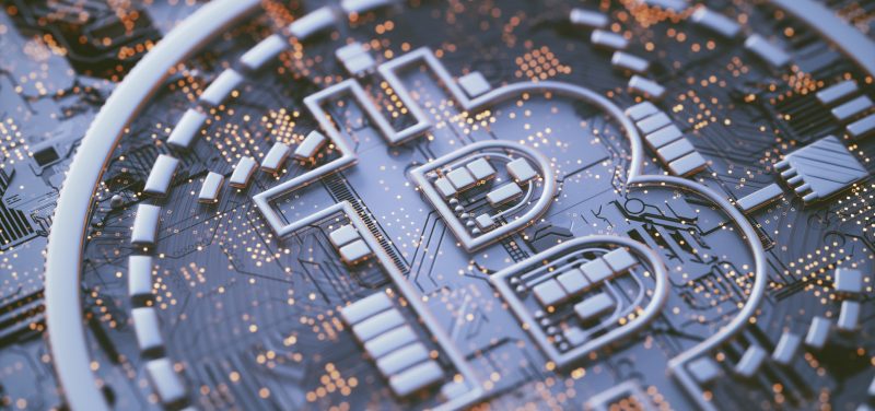 Bitcoin logo on circuit board, illustration